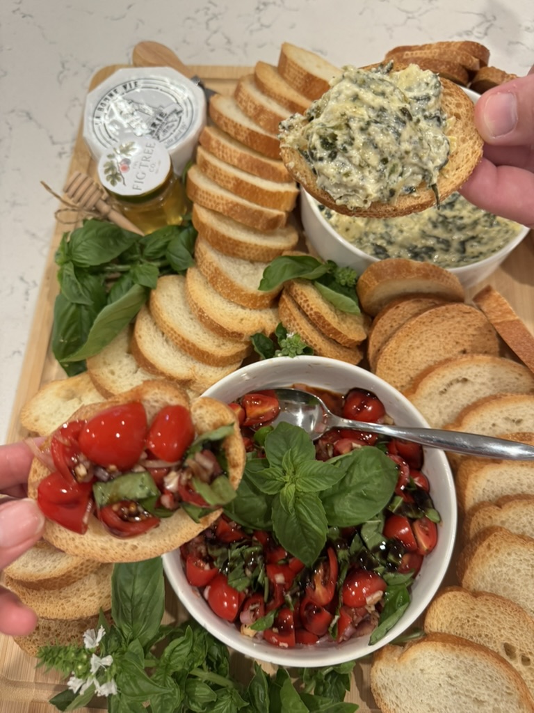 Warm spinach dip, fresh tomato bruschetta, toasted baguette, honey, and basil.